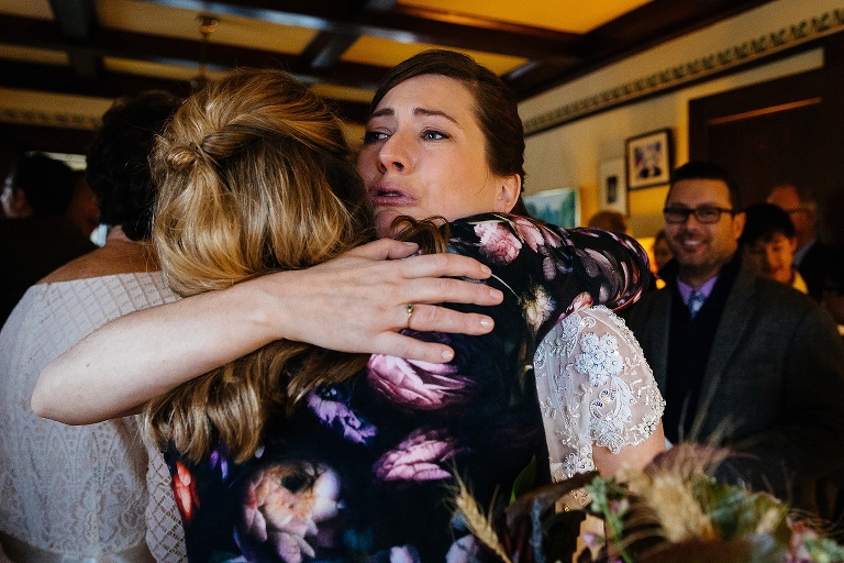 Bride hugs family after getting married