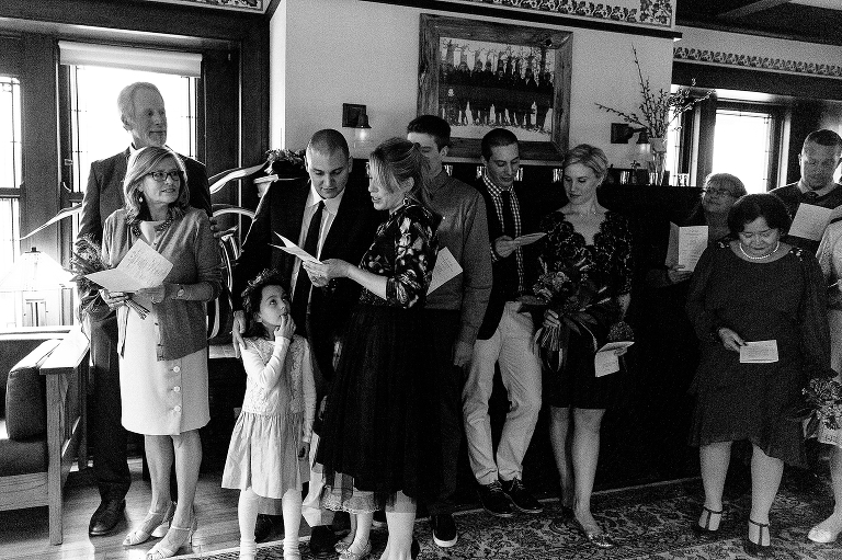 Black and white. Family sings together at wedding ceremony.
