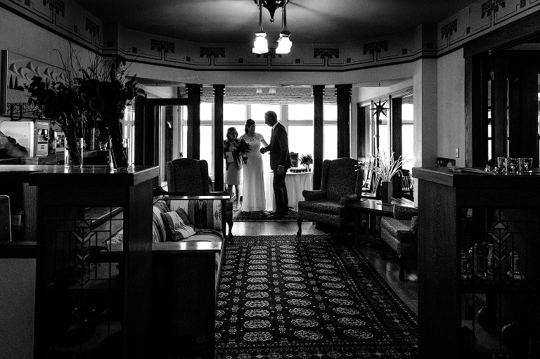 Bride grabs fathers hand before walking down the aisle