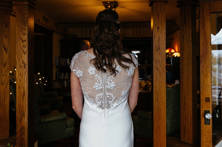 Bride stands in wedding dress getting ready to walk down the aisle