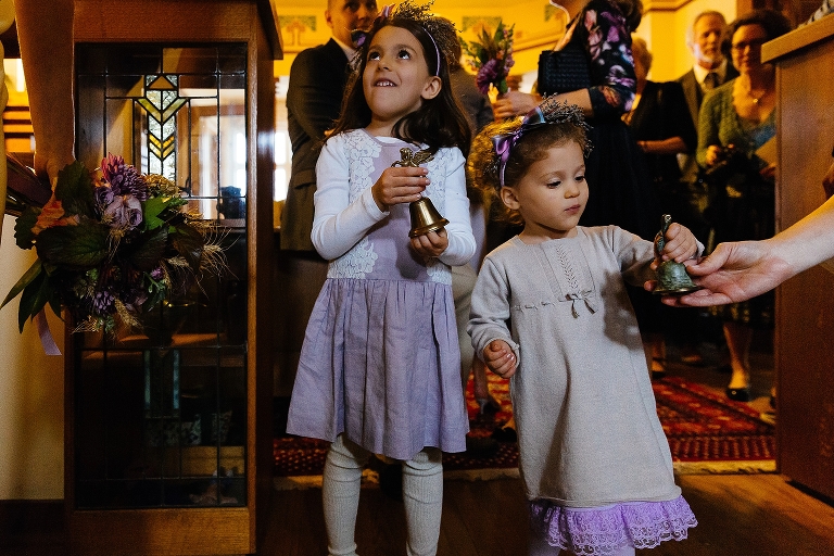Flowers girls get ready to walk down the aisle on wedding day