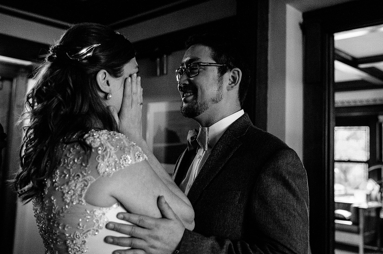 Black and white. Bride and groom cry and smile on their wedding day