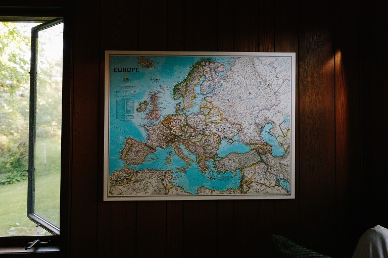 Family map of Europe on living room with late day light coming in. 