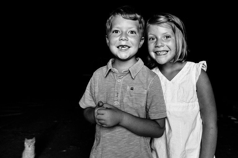 Black and white portrait of a boy and a girl.