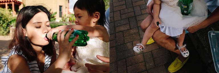 Daughter shares drink wiht mom, daughter sits on dad's lap 