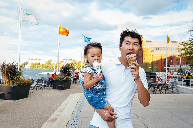 dad and daughter eat melting ice cream at the same time
