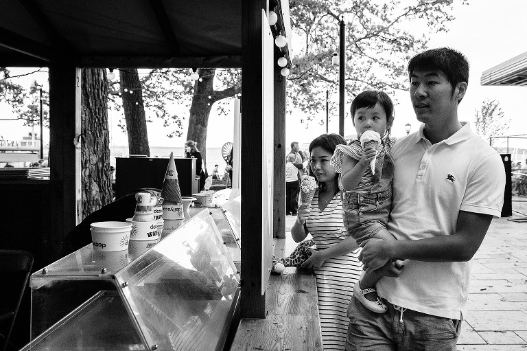 Black and white photo of family ordering ice cream 