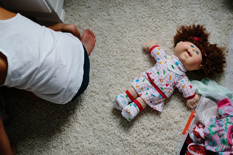 Cabbage Patch Kid on the floor. 