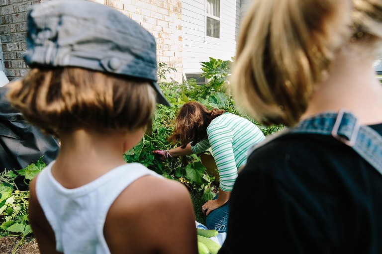 Girls watch Mom hunt for garden zucchinis 