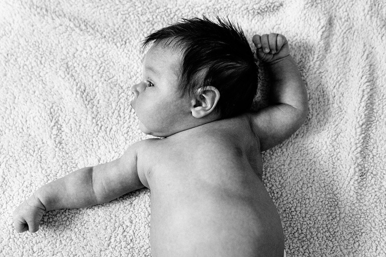 Top down black and white of newborn boy's profile 