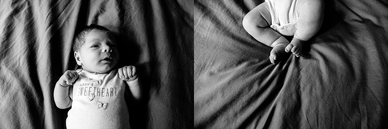 Black and white portrait of newborn on a bed; newborn feet on bed. Blankets wrinkled. 