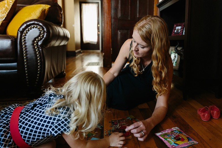 mom and daughter play a puzzle 
