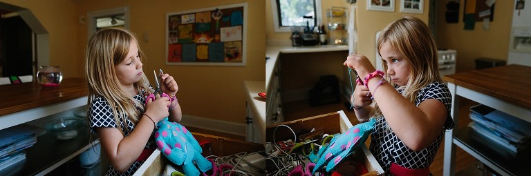 Girl  finishes sewing craft.