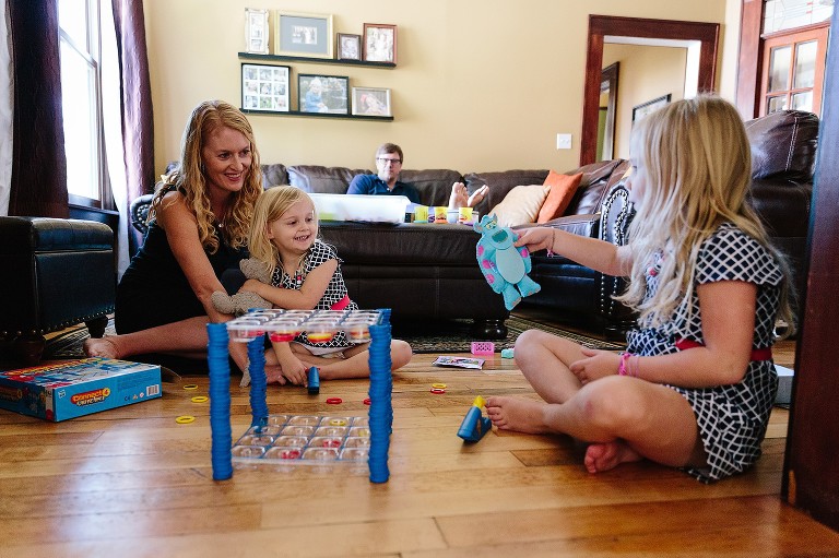Family plays game and shows off sewing craft