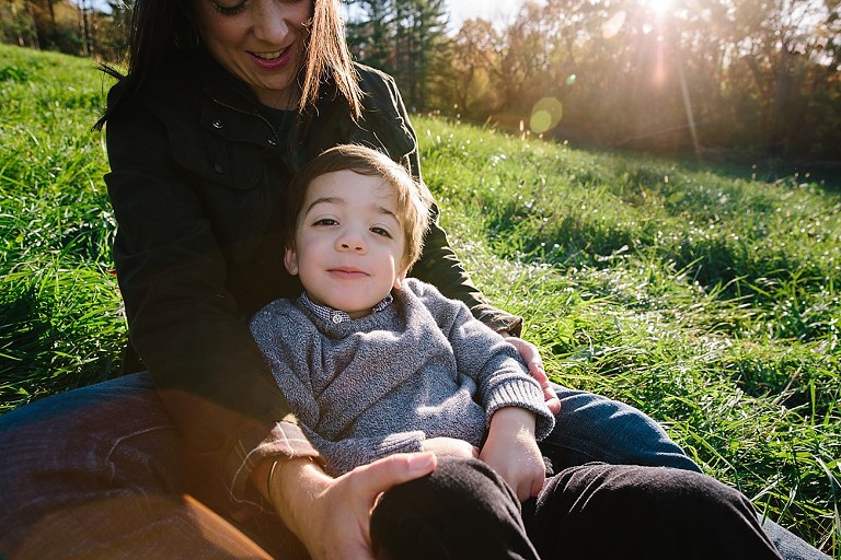 Son sits on mom's lap