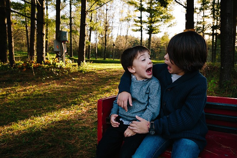 Brothers make silly faces at each other 