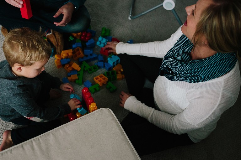 Mother, Father, and Son play with legos together