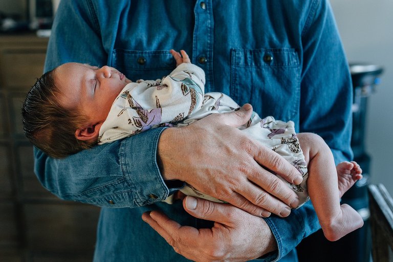Dad holds baby girl