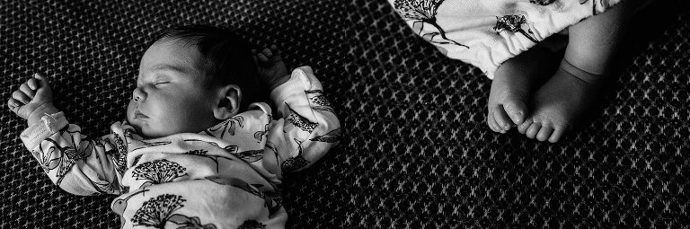 Sleeping newborn on bed 