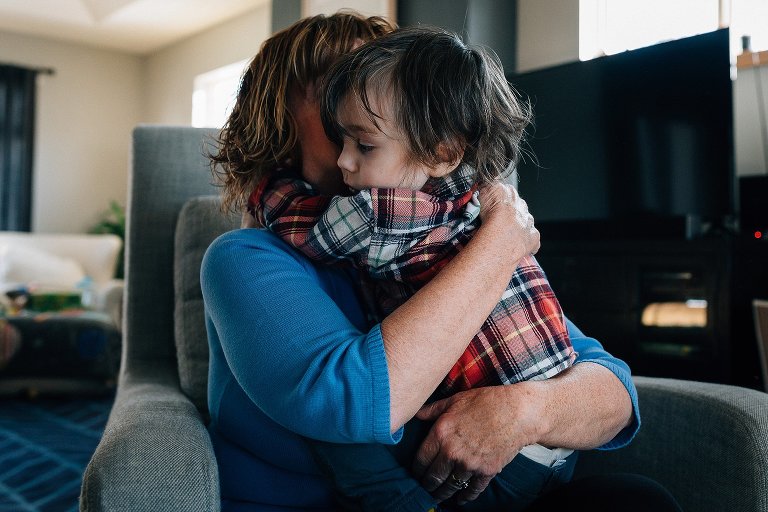 Preschooler and Grandma hug 