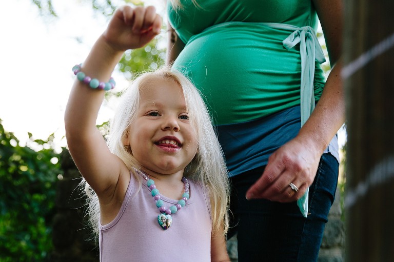 preschool girl and her pregnant mother 