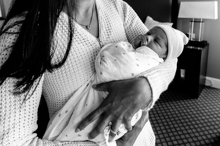 Mom holds newborn baby