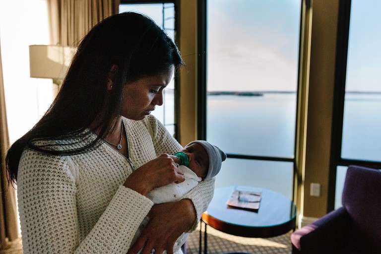 Mom soothes baby at hotel on Lake Mendota. 