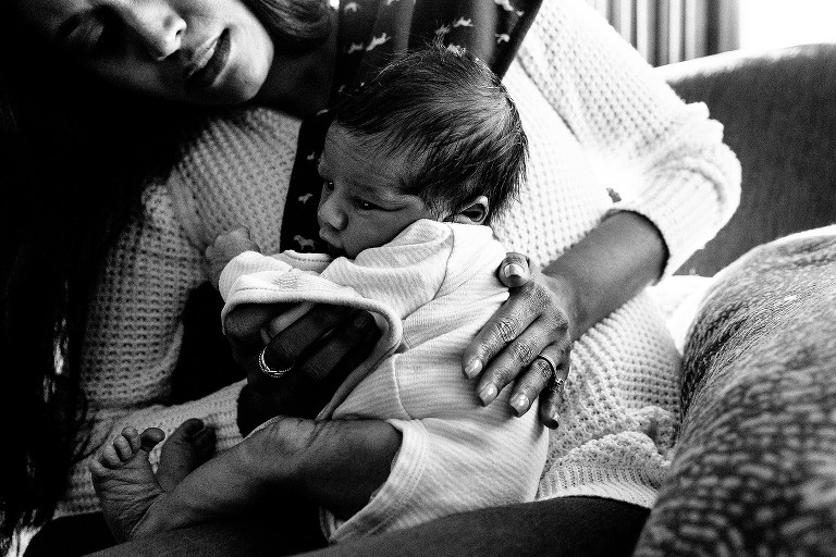 Mom burps newborn baby