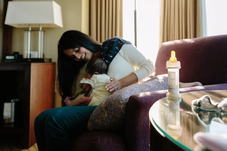 Mom burps newborn baby