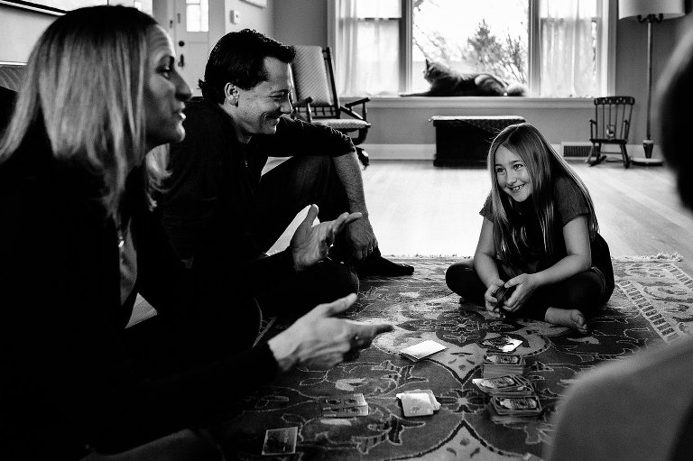 Girl plays game with her parents 