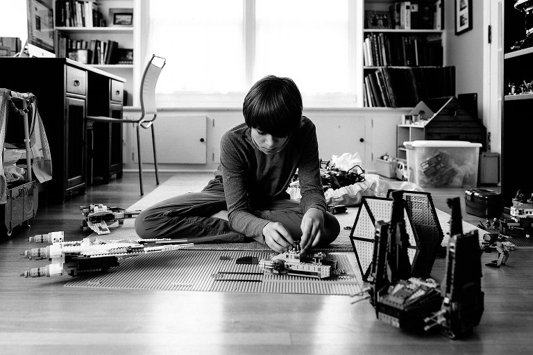 Teen boys works on Legos 