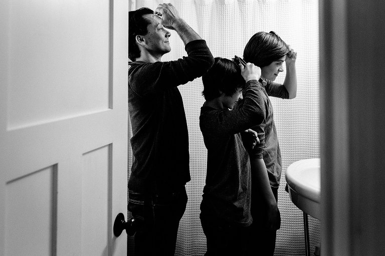 Dad and boys get ready in bathroom mirror 