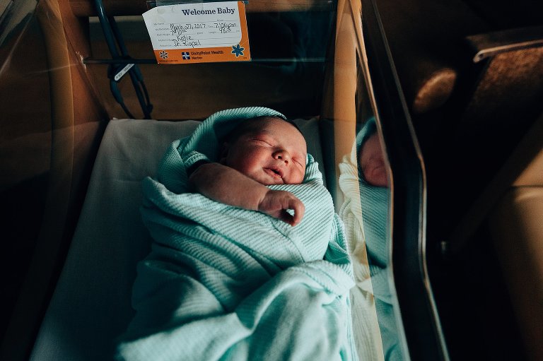 Newborn in bassinet.