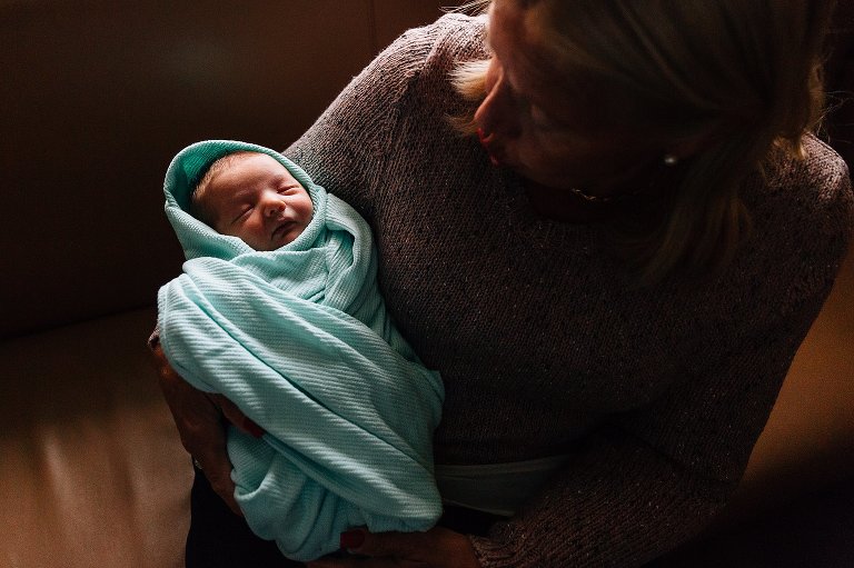 Grandma holding newborn at hospital 