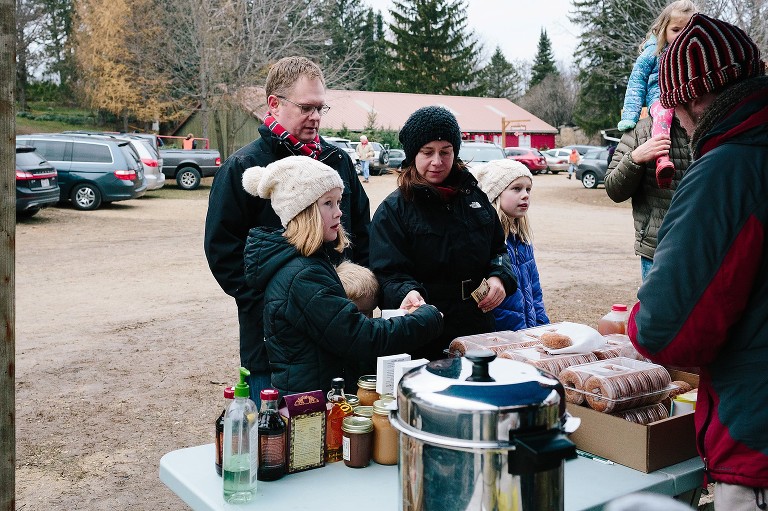 Family of 5 order donuts and cider 