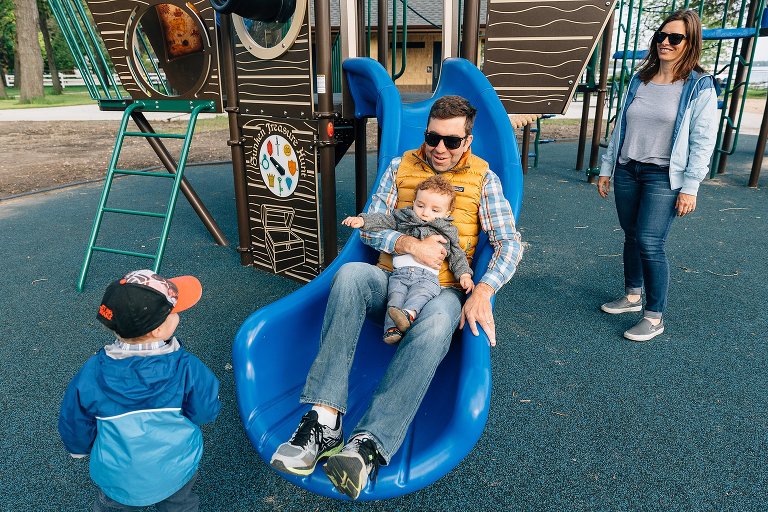 Family plays at playground