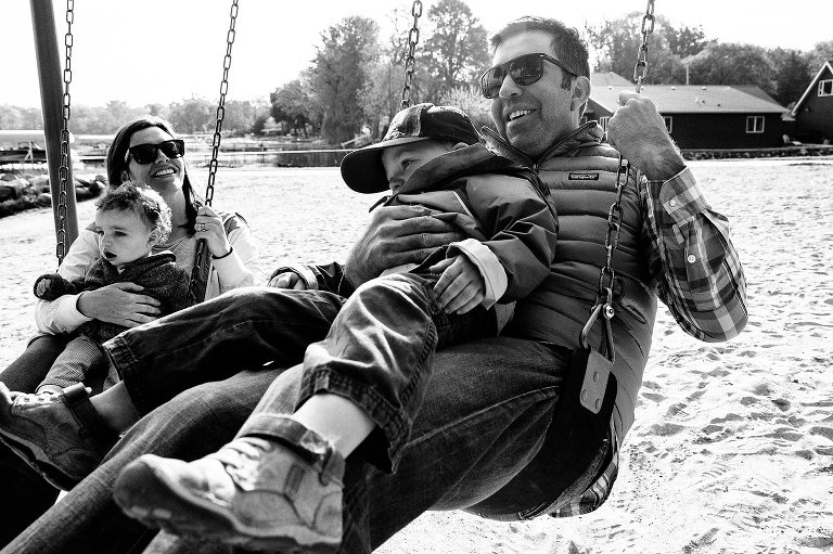 Family swings at beach