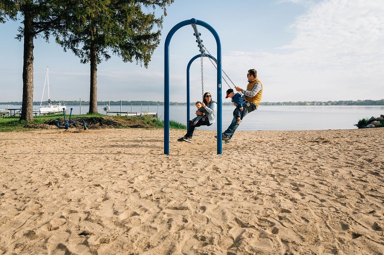 Family swings at beach 