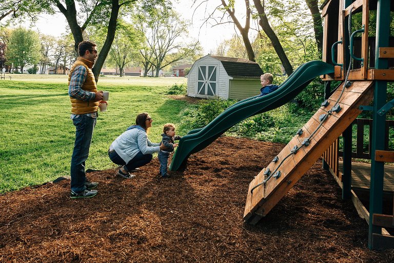 Family plays on play structure