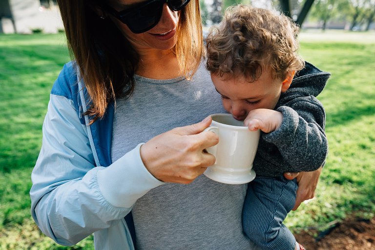 Toddler investigates mom's coffee 