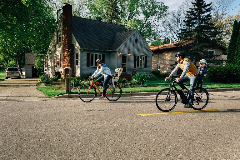 Family bikes in a neighborhood