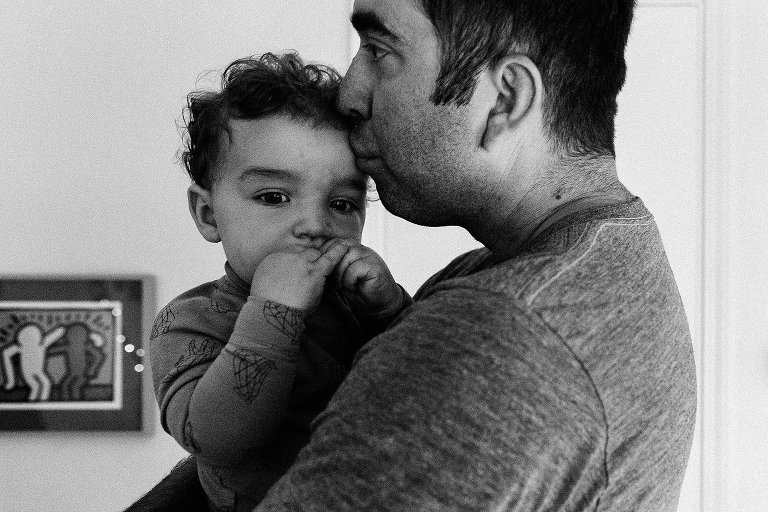 Dad kisses toddler boy