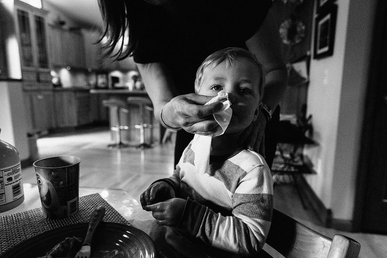 Mom wipes preschooler's nose