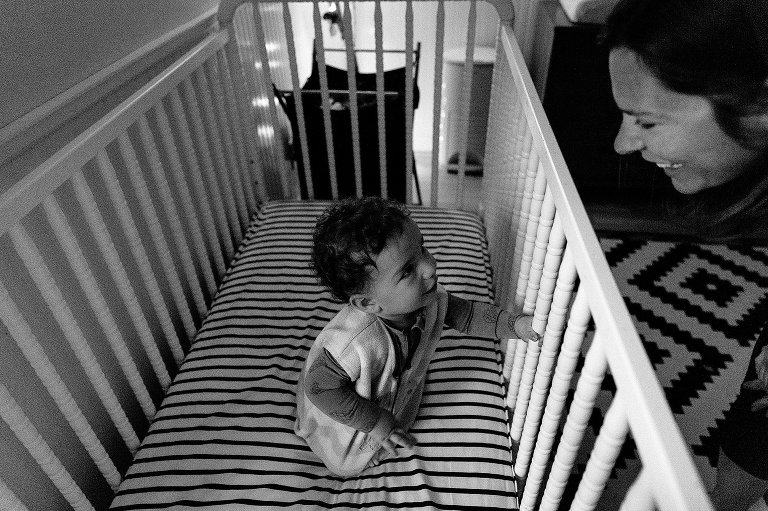 Mother greets young toddler in the morning 
