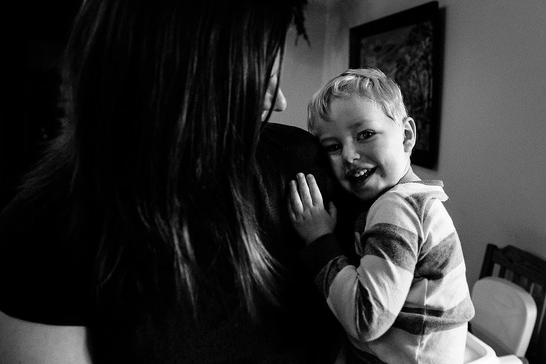 Early morning embrace between mom and young son