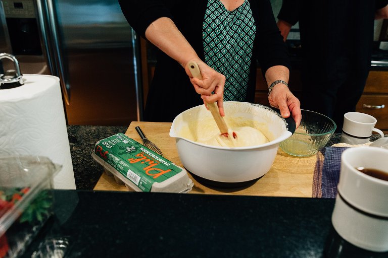 Woman stirs waffle batter