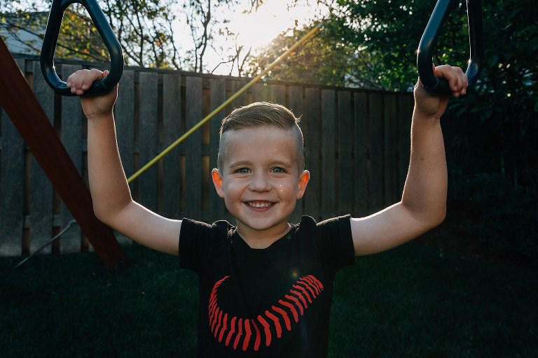 Boy on swing, backlight 
