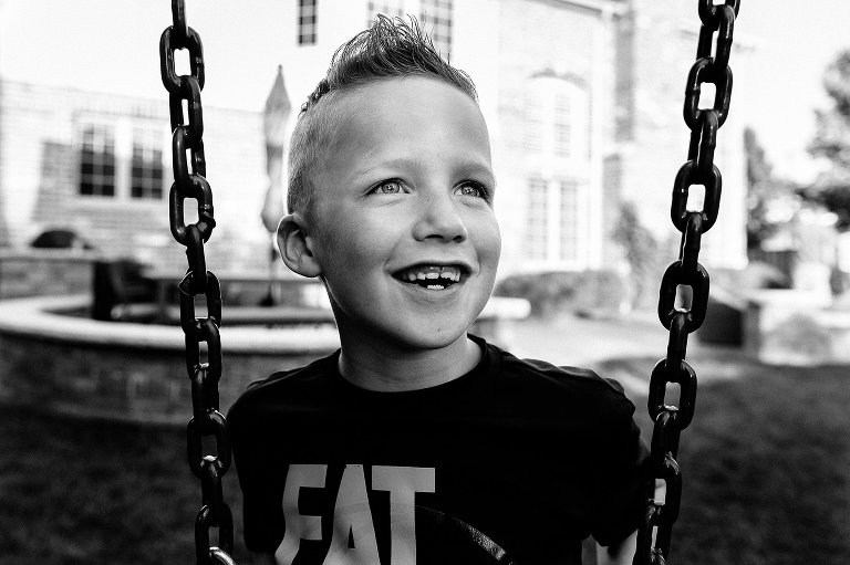 Boy on swing, black and white 