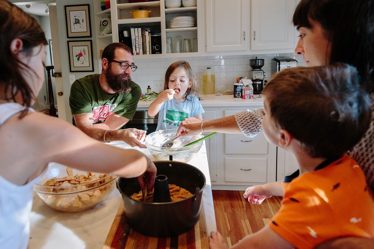 Daughter happy to get a taste of the apple cake batter 