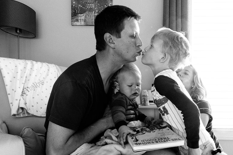Dad and preschool kiss good-night 